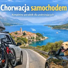 Dwa samochody na drodze z widokiem na chorwackie miasteczko i morze. Pies w oknie.
